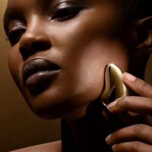 clarins, precious, oro, pietra da massaggio per il viso